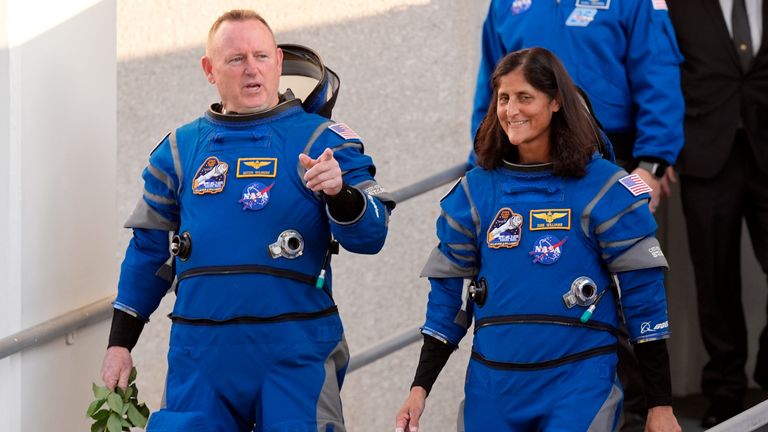 NASA astronauts Butch Wilmore, left, and Suni Williams leave the Operations and Checkout building before heading to Space Launch Complex 41 to board Boeing's Starliner capsule atop an Atlas V rocket for a mission to the International Space Station at the Cape Canaveral Space Force Station, Monday, May 6, 2024, in Cape Canaveral, Fla. (AP Photo/John Raoux)